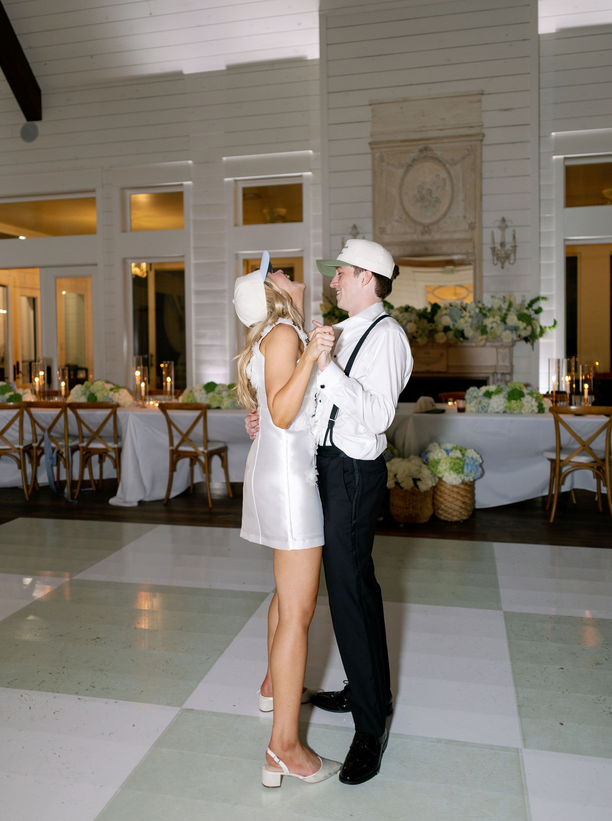 Caroline and Jacob dancing on the custom painted dance floor during the reception