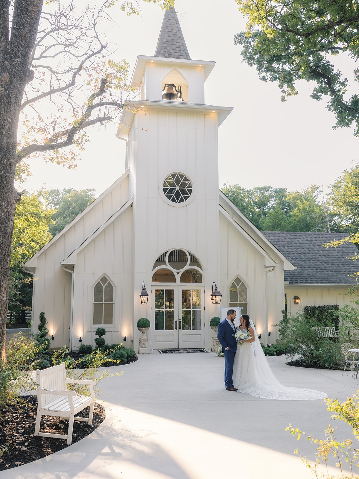 Aerial view of Corynn walking down the aisle with her father during the ceremony at The French Farmhouse chapel