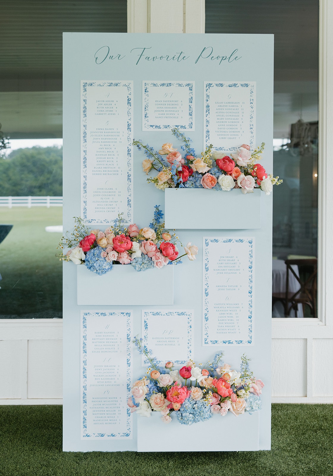 Elegant blue floral seating chart — Our Favorite People