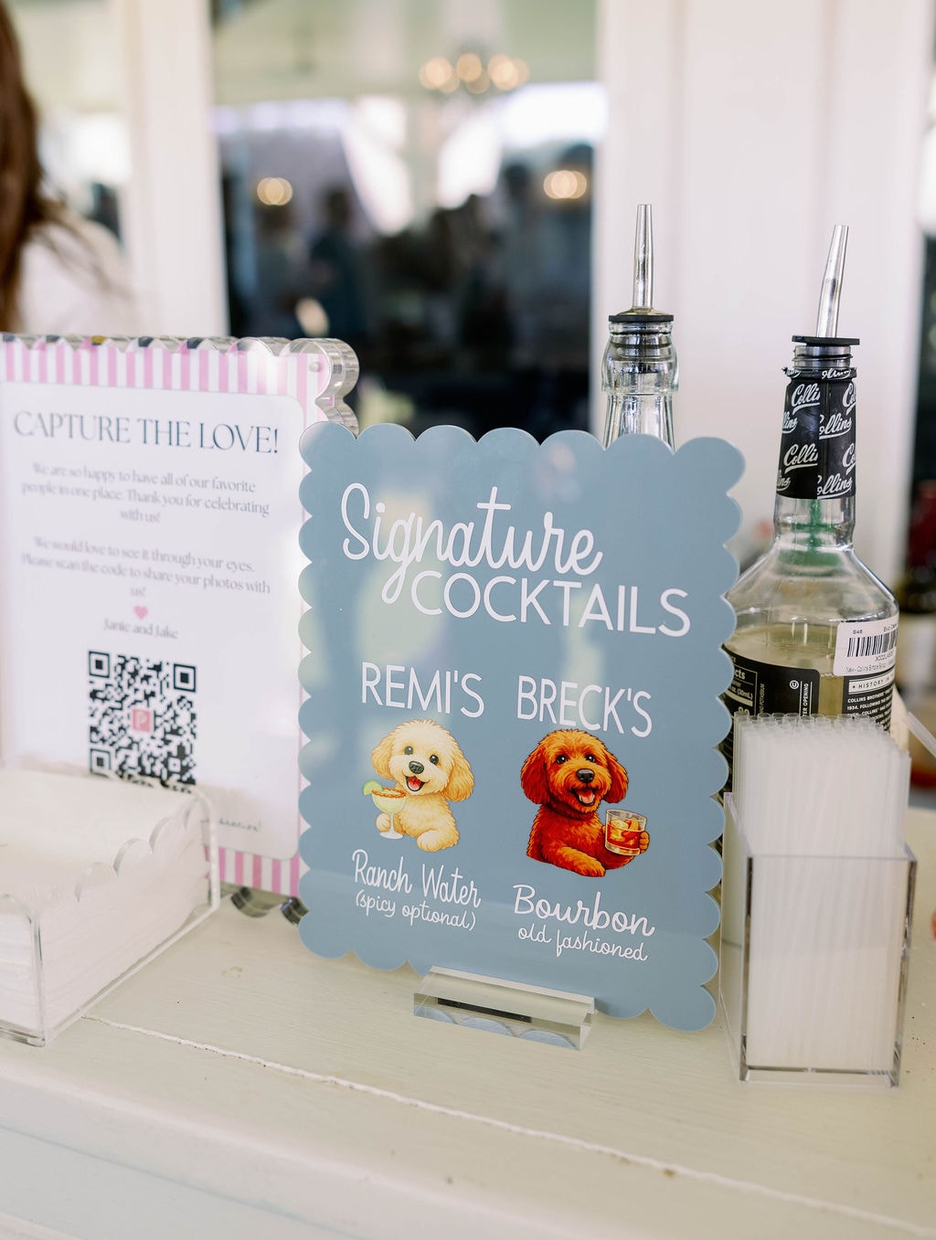 Signature cocktail sign featuring Remi's Ranch Water and Breck's Bourbon Old Fashioned with illustrated dogs