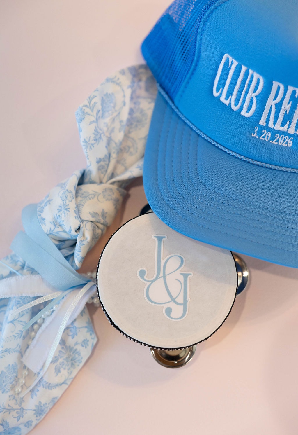 Club Rehfuss blue trucker hat with J and G monogram tambourine and blue toile ribbon