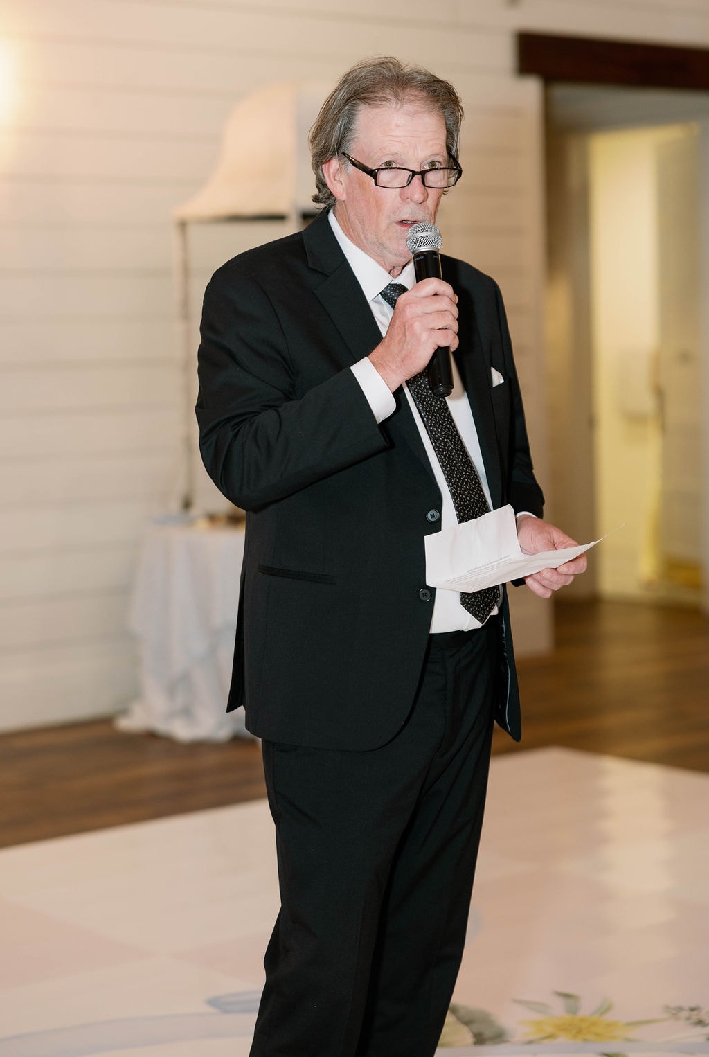 Guest delivering a heartfelt toast at the Janie and Jake reception