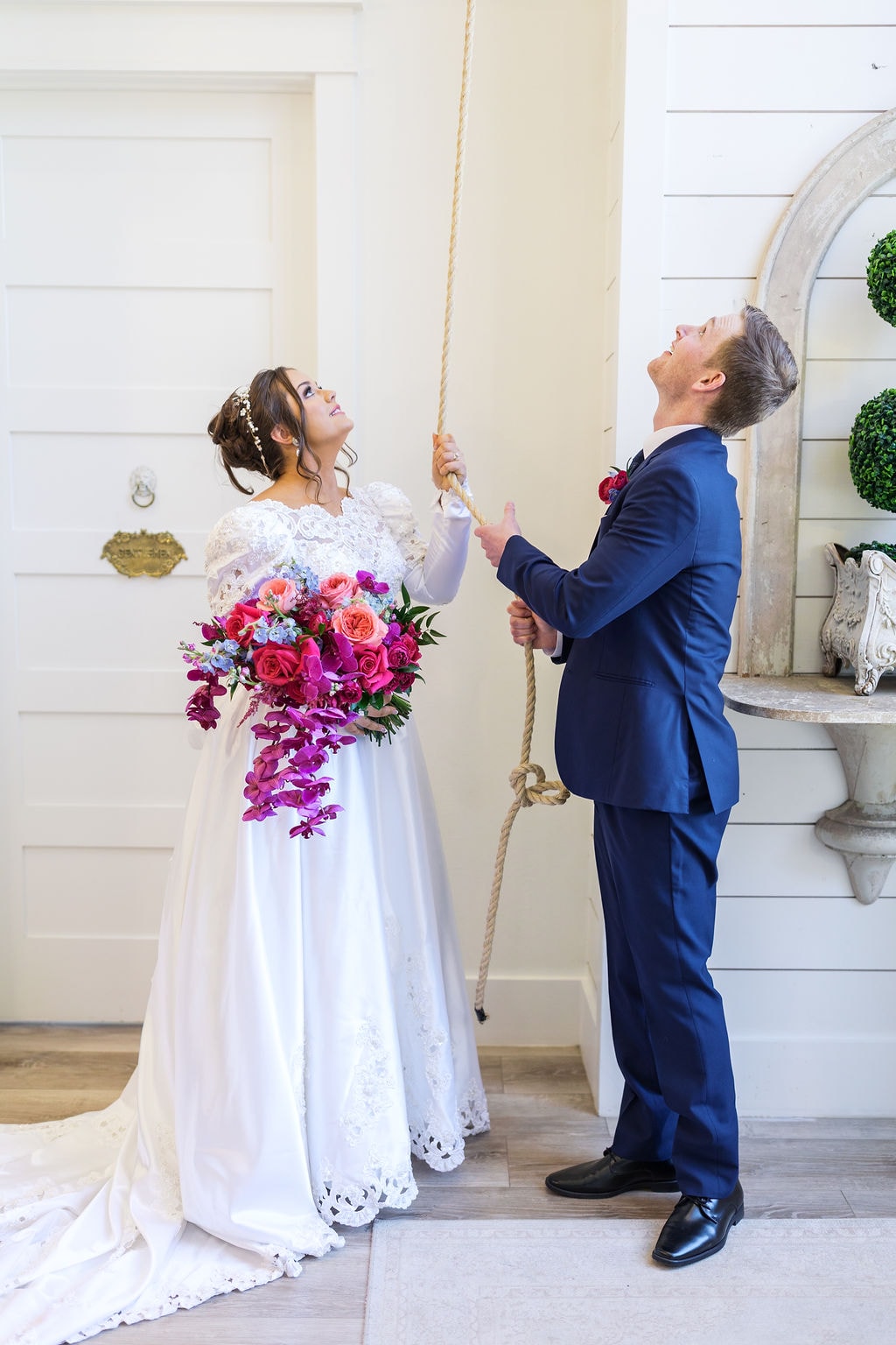 Katherine and Hayden ringing the bell together after the ceremony