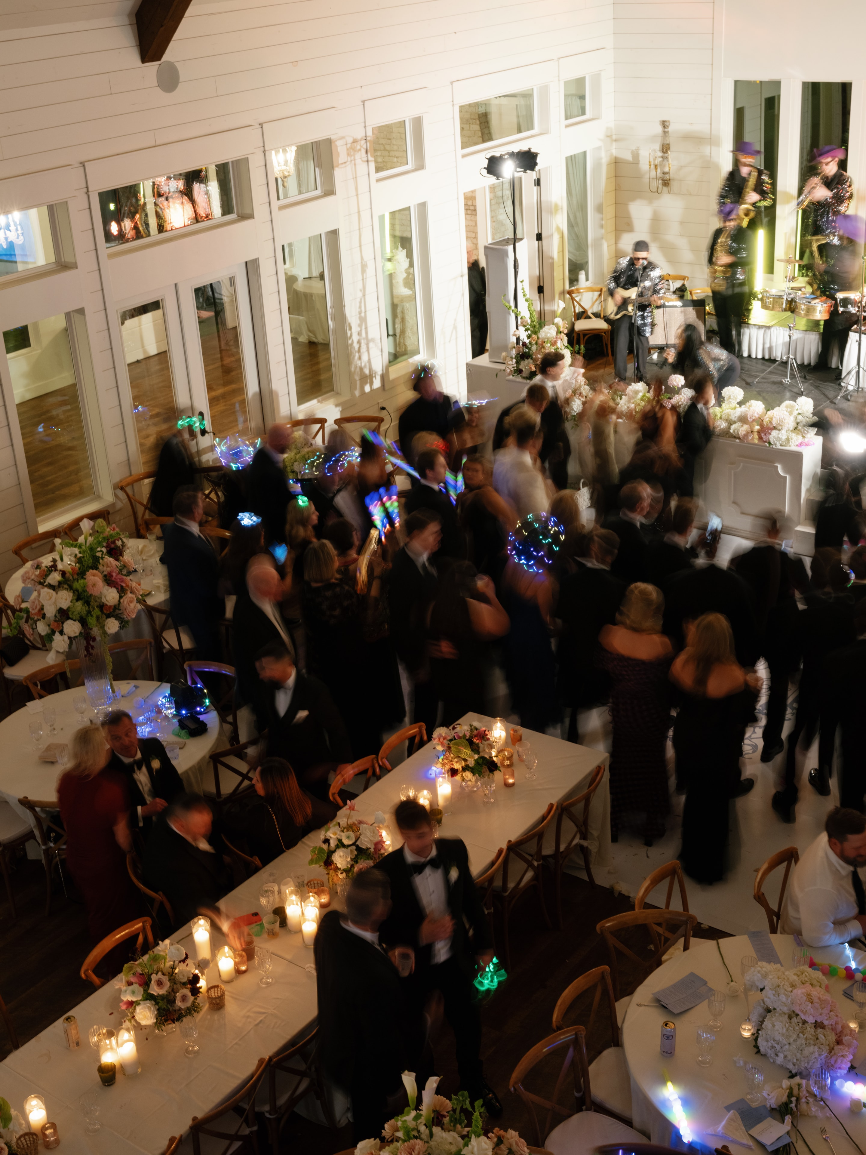 Aerial view of the full dance floor packed with guests dancing to Emerald City Band at the Megan and Rex reception