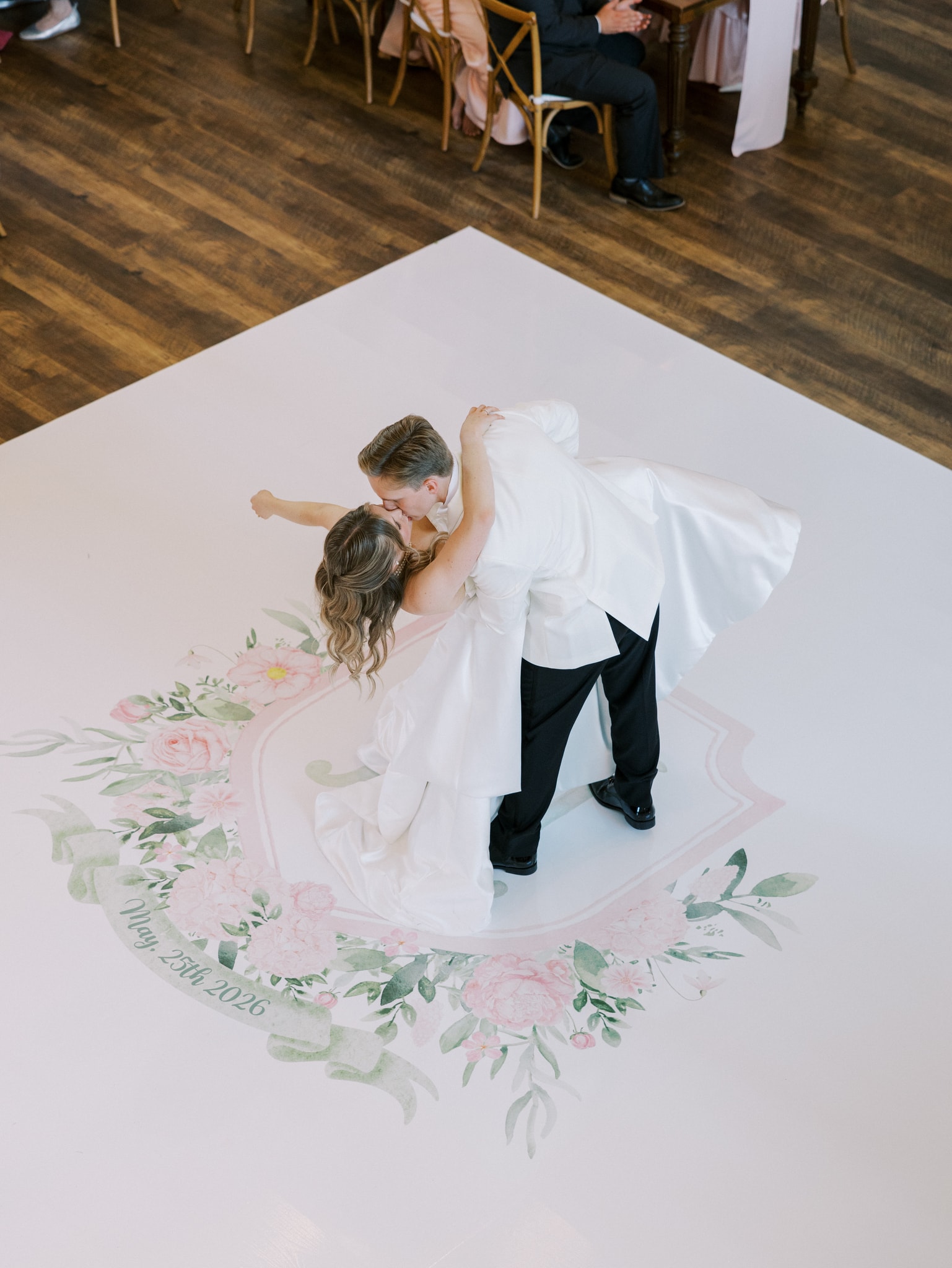 Morgan and Jack sharing a romantic dip on the dance floor during their first dance at The French Farmhouse Venue reception