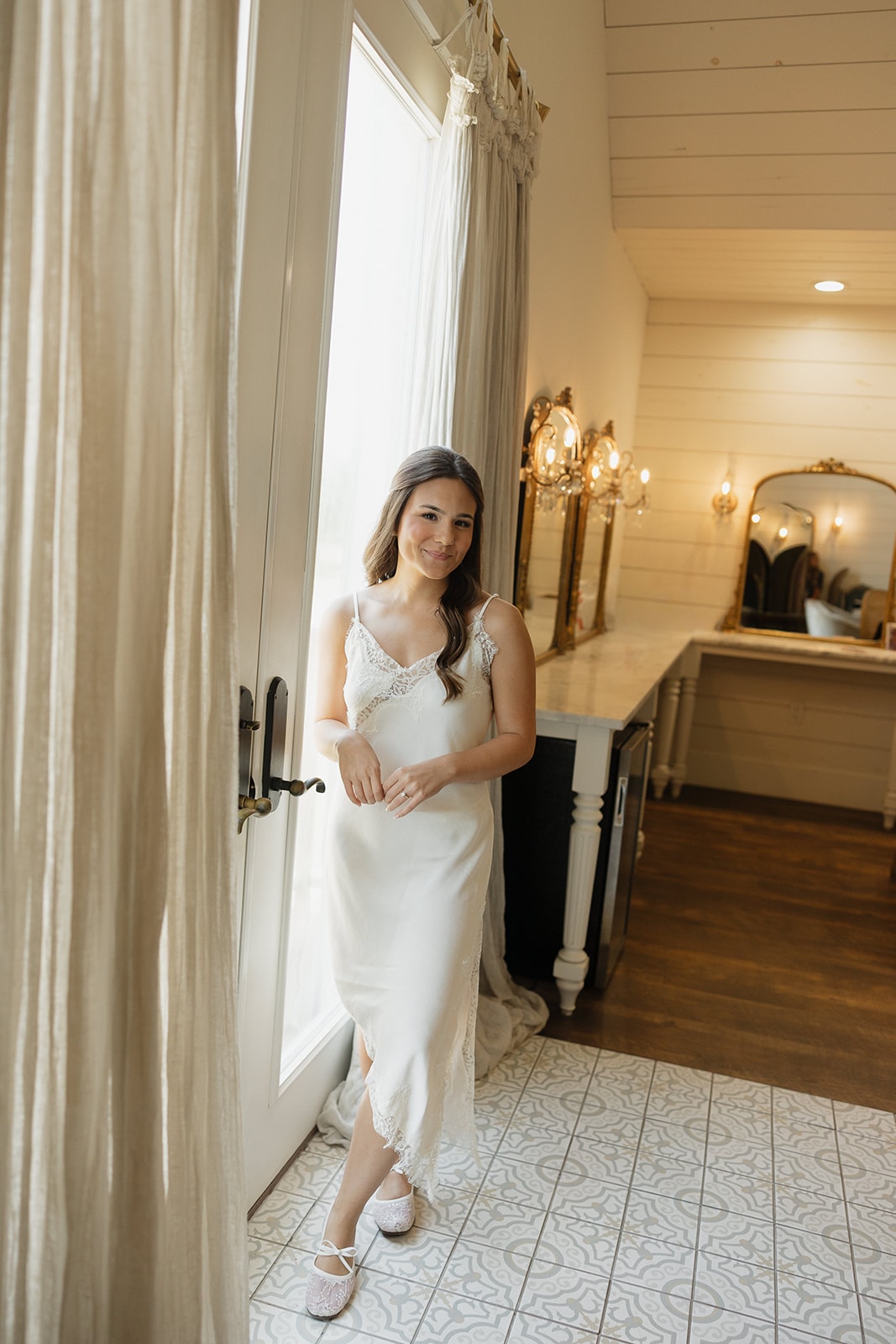 Bride getting ready in the bridal suite on her wedding morning