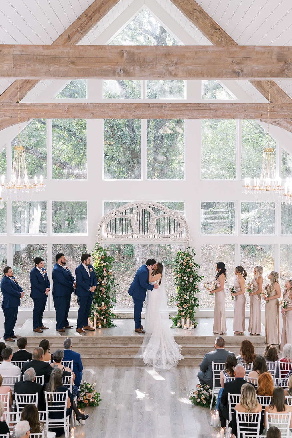 Shelby and Cole sharing their first kiss at the altar inside The French Farmhouse chapel
