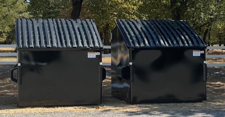 Two new black dumpsters at The French Farmhouse venue