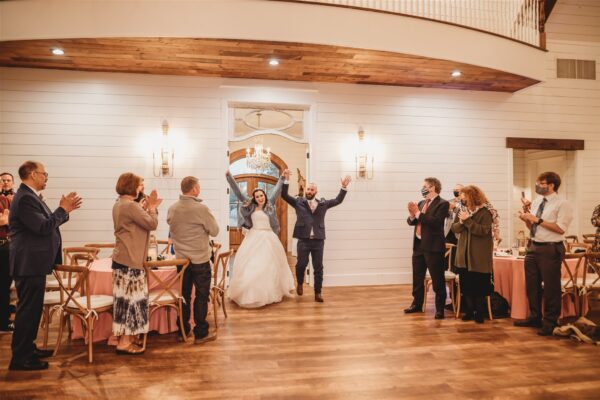 Bride and Groom make their big entrance to their reception